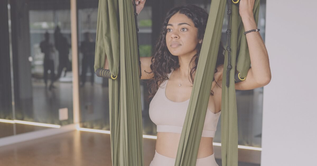 Aerial Yoga 12 Benefits practice with hammock support