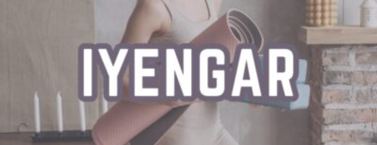 Iyengar yoga woman holding yoga wheel prop for alignment practice at home