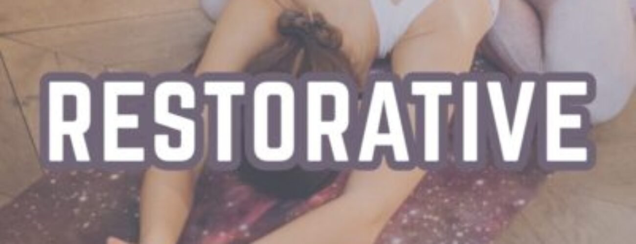 Restorative yoga poses woman in child pose using props bolsters for gentle stretching relaxation