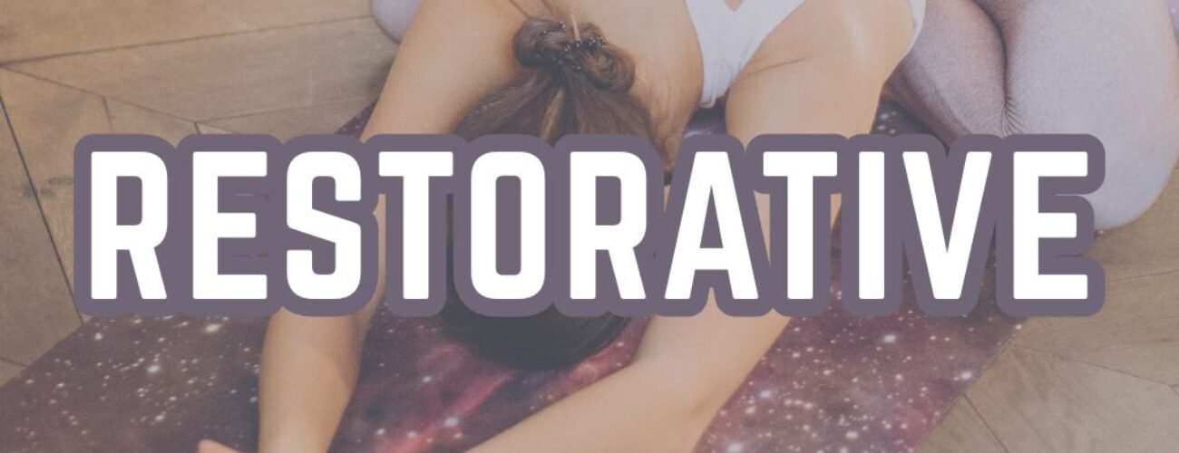 Restorative yoga poses woman in child pose using props bolsters for gentle stretching relaxation